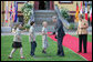 President George W. Bush reaches out to youngsters who were on hand to greet him upon his arrival Wednesday night at the Hohen Luckow Estate in Hohen Luckow, Germany. The President and Mrs. Laura Bush joined other G8 leaders and their spouses for a dinner hosted by Germany's Chancellor Angela Merkel and her husband, Dr. Joachim Sauer. White House photo by Eric Draper