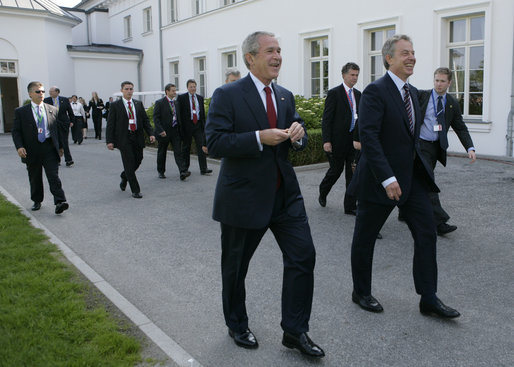 President George W. Bush and Prime Minister Tony Blair of the United Kingdom walk to the Grand Hotel after their meeting Thursday, June 7, 2007, in the Music Salon of the Kempinski Grand Hotel in Heiligendamm, Germany. Among the issues covered, the two leaders discussed AIDS, global warming and Darfur. White House photo by Eric Draper