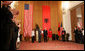 President George W. Bush receives the Order of the National Flag Award from President Alfred Moisiu during an arrival ceremony Sunday, June 10, 2007, in Tirana, Albania, as Mrs. Laura Bush and Ms. Mirela Moisiu look on. The visit by the President and Mrs. Bush marked the first to Albania by a sitting U.S. president. White House photo by Chris Greenberg