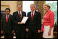 President George W. Bush receives the Report to the President on Issues Raised by the Virginia Tech Tragedy in the Oval Office Wednesday, June 13, 2007, presented to President Bush by Attorney General Alberto Gonzales; U.S. Secretary of Health and Human Services Michael O. Leavitt and U.S. Secretary of Education Margaret Spellings. The report was compiled by the departments of Justice, Health and Human Services and Education in response to the tragic shooting rampage at Virginia Tech April 16, 2007 in Blacksburg, Va. White House photo by Eric Draper