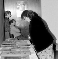 Katherine Blood, assistant curator for fine prints, examines samples of cartoon work.