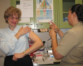 Joyce Somsak, H R S A Associate Administrator for Healthcare Systems, gets ready for her flu shot.
