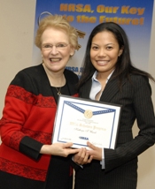 Dr. Duke awards a certificate to 2005 Scholar Kathryn Umali.