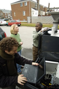 Lead author Keri Hornbuckle, left in green sweater, discussed the equipment installation with van driver Roger Peck