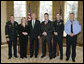 President George W. Bush meets Thursday, March 16, 2006 in the Oval Office of the White House with recipients of the Public Safety Officer Medals of Valor. From left to right are, Gene F. Large Jr., Fire Battalion Chief in Fort Walton Beach, Fla.; Marissa Hurst, wife of slain Officer Bryan S. Hurst of Columbus, Ohio; Peter Alfred Koe, Police Officer of Indianapolis, Ind.; Timothy Greene, Police Officer from Rock Hill, S.C.; and Firefighter Edward Frederic Henry of Charleston, S.C. White House photo by Paul Morse