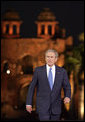 President George W. Bush acknowledges the audience as he arrives for remarks Friday, March 3, 2006, at the Purana Qila in New Delhi. White House photo by Paul Morse