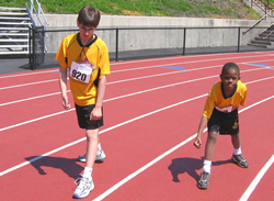 Two of Coach Otterbein's younger athletes, Matthew Hollin and Houston McDaniel, get ready to run track.