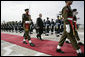 President George W. Bush is escorted by an honor guard as he reviews Pakistan troops at his official welcome to Aiwan-e-Sadr in Islamabad, Pakistan, Saturday, March 4, 2006. White House photo by Eric Draper