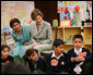 Mrs. Laura Bush listens to a student answer a question as she attends a class lesson in the Children's Resources International clasroom at the U.S. Embassy , Saturday, March 4, 2006 in Islamabad, Pakistan. White House photo by Shealah Craighead