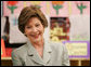 Mrs. Laura Bush reacts to a question as she attends a class lesson in the Children's Resources International clasroom at the U.S. Embassy , Saturday, March 4, 2006 in Islamabad, Pakistan. White House photo by Shealah Craighead