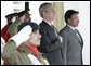 President George W. Bush and Pakistan President Pervez Musharraf stand together during President Bush's official welcome to Aiwan-e-Sadr in Islamabad, Pakistan, Saturday, March 4, 2006. White House photo by Eric Draper