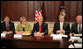 President George W. Bush joins members of the Academic Competitiveness Council Monday, March 6, 2006, during a meeting at the Eisenhower Executive Office Building. From left are: Secretary Norman Mineta, Department of Transportation; Secretary Margaret Spellings, Department of Education; Secretary Carlos Gutierrez, Department of Commerce, and Secretary Samuel Bodman, Department of Energy. White House photo by Kimberlee Hewitt