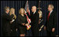 President George W. Bush joins Victoria Lazear and her daughter Julie as Chief of Staff Andy Card swears in Eddie Lazear Monday, March 6, 2006, as Chairman of the Council of Economic Advisers during a ceremony in the Eisenhower Executive Office Building. White House photo by Kimberlee Hewitt