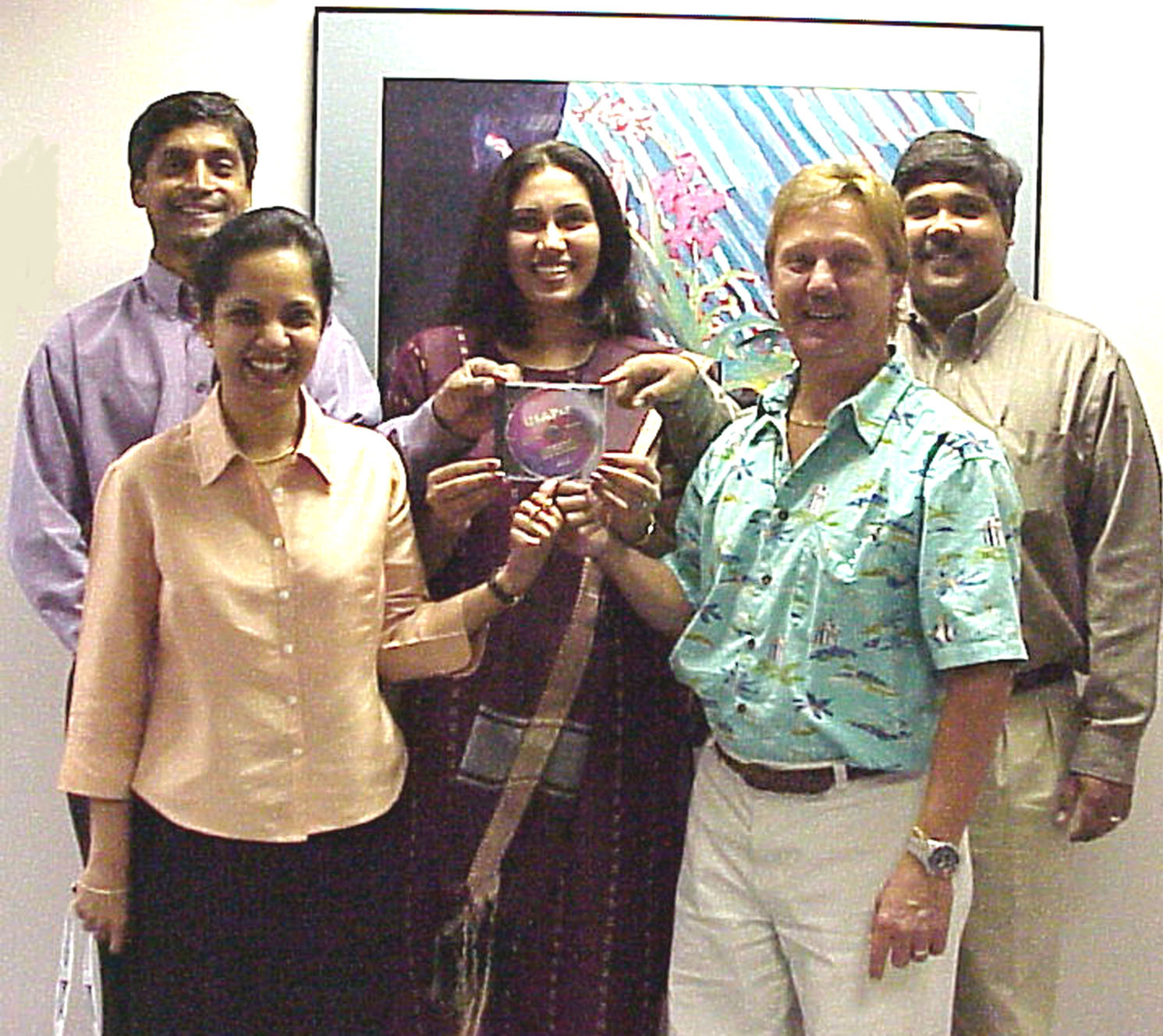 Figure 1 DocDW Team with the Final USAPat Back File Disc (from left to right, Yousef Nawab, Usha Anantharayan, Shahana Begum, Jeff Alderson, and Veda Raman)
