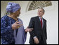 President George W. Bush and Liberia's President Ellen Johnson Sirleaf talk as they walk along the Colonnade from the Oval Office at the White House, Tuesday, March 21, 2006. White House photo by Eric Draper