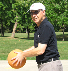 A HRSA employee playing basketball.