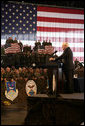 Vice President Dick Cheney thanks troops and their families for their efforts in the global war on terror during remarks delivered at Scott Air Base in Illinois, Tuesday, March 21, 2006. Scott Air Base is the home of the US Transportation Command (USTRANSCOM), which coordinates worldwide transportation efforts using both military and commercial resources. During an average week, USTRANSCOM conducts more than 1,900 air missions and 10,000 ground shipments in 75 percent of the world's countries. White House photo by David Bohrer