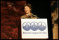 Mrs. Laura Bush addresses an audience Tuesday, March 14, 2006 at the National League of Cities Conference in Washington, asking for their communities continued support of the Helping America's Youth initiative. White House photo by Shealah Craighead