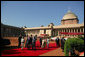 President George W. Bush and Laura Bush arrive at Rashtrapati Bhavan in New Delhi Thursday, March 2, 2006, and are escorted to welcome ceremonies by India's President A.P.J. Abdul Kalam and Prime Minister Manmohan Singh and his wife, Gusharan Kaur. White House photo by Paul Morse