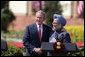 President George W. Bush and India's Prime Minister Manmohan Singh exchange handshakes Thursday, March 2, 2006, after their press availability at the Hyderabad House in New Delhi. White House photo by Paul Morse