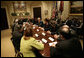 President George W. Bush speaks with participants in a meeting on immigration reform Thursday, March 23, 2006, in the Roosevelt Room of the White House. White House photo by Eric Draper