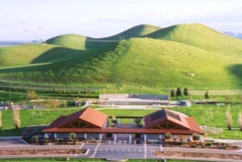 Photo of an aerial view of the cemetery's administration building with green rolling hills flowing in the background.