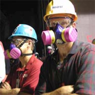 Doctors wearing respirators while on-site