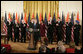 President George W. Bush is applauded as he addresses his remarks to invited guests prior to signing H.R. 5682 The United States-India Peaceful Atomic Cooperation Act, Monday, Dec. 18, 2006, in the East Room of the White House. Left to right are Rep. Thaddeus McCotter, R-Mich.; Rep.Gary Ackerman, D- NY; Sen. Richard Lugar, R-Ind.; Sen. Bill Frist, R-Tenn.; Secretary of State Condoleezza Rice; Rep. Joseph Crowley, D-NY; Sen. George Allen, R- Va.; Rep. Frank Pallone Jr., D-NJ; and Ambassador to the U.S. Raminder Jassal, Charge D’affaires of India. White House photo by Eric Draper