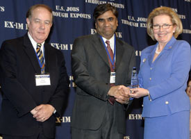 A manufacturer of equipment to produce solar wafers, cells and panels, GT Equipment Technologies of Merrimack, N.H., received the 2005 Small Business Environmental Exporter of the Year award from the Ex-Im Bank. Keda Gupta, CEO, GT Equipment Technologies, pictured center, is congratulated by Ex-Im Bank Director Linda Conlin, right while Mr. Fred Kocher, Sr. Advisor at GT Equipment Technologies looks on.