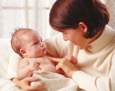 Photograph of a mother holding a baby