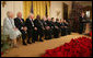 President George W. Bush looks back as he addresses the 2006 recipients of the Presidential Medal of Freedom on stage in the East Room of the White House Friday, Dec. 15, 2006. Said the President, "The Presidential Medal of Freedom is our nation's highest civil honor. The medal recognizes high achievement in public service, science, the arts, education, athletics, and other fields. Today we honor 10 exceptional individuals who have gained great admiration and respect throughout our country." White House photo by Shealah Craighead