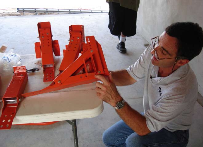 NIOSH researcher assembling roof brackets that will be used on a residential construction site
