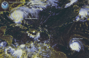 NOAA satellite image of Hurricanes Frances and Ivan taken at 11:15 a.m. ET on Sept. 5, 2004, as Frances makes its way across Florida and Ivan marches across the Caribbean for an eventual landfall in the USA Gulf Coast.