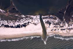 NOAA aerial image of Gulf Shores, Ala., after Hurricane Ivan made landfall on Sept. 16, 2004, to see how the powerful storm cut a swath across a barrier island.