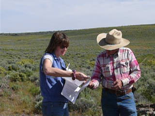 Partners coordinator with private landowner. Photo USFWS.