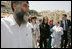 Laura Bush departs the Western Wall after inserting a prayer in the wall and taking a tour of the model of Mount Moriah Sunday, May 22, 2005.