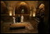 Brother Olivier, prior of the monastery, discusses the historical significance of the Church of the Resurrection at Abu Gosh, during Laura Bush's visit to the monastery in Israel, May 23, 20005.