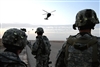 UH-60 Black Hawk helicopters approach a landing area as U.S. Army soldiers prepare for an air assault onto the banks of the Tigris River, Bayji, Iraq, Oct. 14, 2008. 