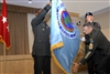 U.S. Army Gen. William E. Ward, Commander, U.S. Africa Command, left, and Command Sergeant Major of the U.S. Africa Command Mark S. Ripka unfold the command's new flag during the Command activation ceremony in the Pentagon, Oct. 1, 2008.