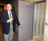 Lukow shows visitors the environmentally controlled vaults where delicate and/or dangerous audio-visual materials will be housed.