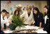 Mrs. Laura Bush works with students from the Williams Preparatory School in Dallas, Thursday, April 10, 2008, during planting events at the First Bloom program to help encourage youth to get involved with conserving America's National Parks.