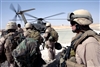 U.S. Navy Command Master Chief James Heiland prepares to board a Marine CH-53 helicopter during a current visit to the battalion worksites in western Iraq, Oct. 6, 2008. 