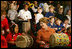 Mrs. Laura Bush joins in a musical number playing a drum with children at the Louisiana Children’s Museum in New Orleans, Tuesday, Jan. 9, 2007, during her visit to see the rebuilding progress in the Gulf Coast region. The museum, closed nearly a year following the 2005 hurricanes, is working to address the needs of young children and families seeking a safe and nurturing environment. White House photo by Shealah Craighead 