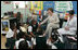 Mrs. Laura Bush talks with students during her visit to Our Lady of Perpetual Help School in Washington, Monday, June 5, 2006, where she announced a Laura Bush Foundation for America's Libraries grant to the school. Mrs. Bush is joined by Our Lady of Perpetual Help fifth grade teacher Julie Sweetland, right.