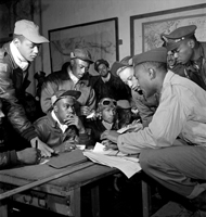 several of the men go over plans, 1945