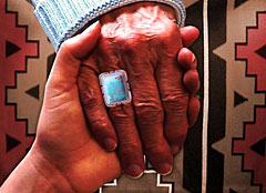 A youth hand holding a elder's hand