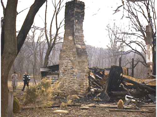 Log cabin where fire occurred.