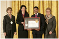 Mrs. Laura Bush along with Dr. Anne Radice, the Director of the Institute of Museum and Library Services, right, presents a 2007 National Awards for Museum and Library Services awards to both Nancy Stueber, Director, and Priyam Shah, Community Representative of the Oregon Museum of Science & Industry, Portland, OR, during a ceremony in the East Room at the White House Monday, January 14, 2008. "Regular visitors to OMSI can touch a tornado, uncover a fossil, experience an earthquake, visit the Northwest's largest planetarium, explore a Navy submarine, or just experiment on their own in one of eight hands-on labs." Mrs. Bush said of the Oregon Museum of Science & Industry during her remarks.