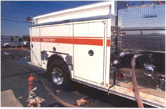 Photo 1. Engine’s passenger side discharge panel; depicts fill line connected to #4 discharge and water holding tank’s hydrant.