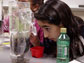 Photo of girl performing a science experiment.